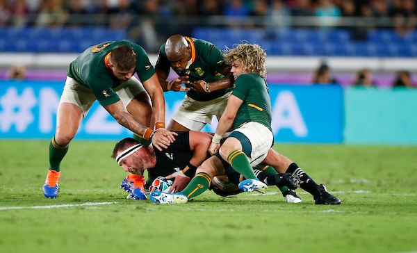 Springboks Malcolm Marx and Makazole Mapimpi and Faf de Klerk tackling Kieran Read