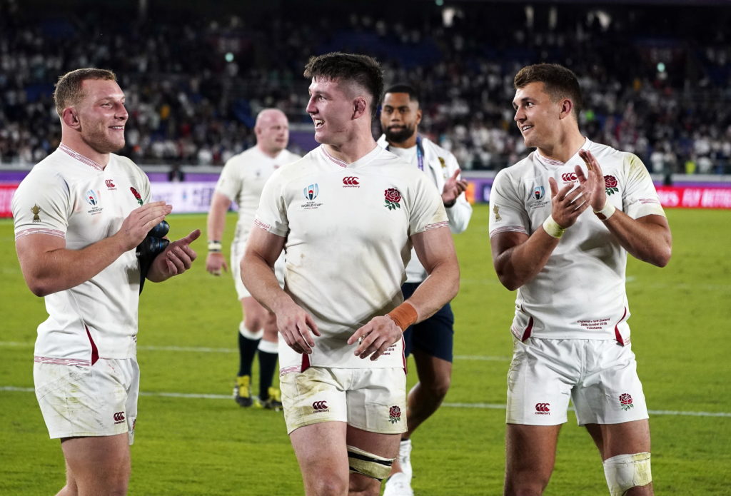 England players Sam Underhill (L) and Tom Curry (C) celebrate after winning the Rugby World Cup 2019 semi final match between New Zealand and England