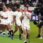 Tom Curry and his England teammates celebrate after beating new Zealand