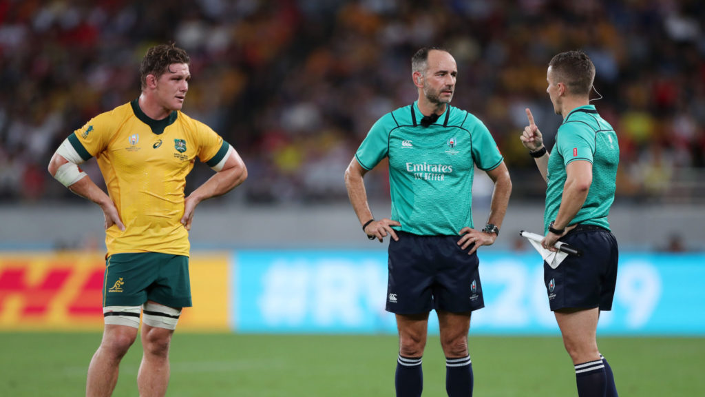 Michael Hooper with World Rugby referees Romain Poite and Luke Pearce