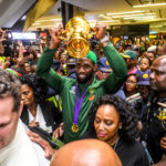 Siya Kolisi lifts the Webb Ellis trophy after the Springboks return from the World Cup