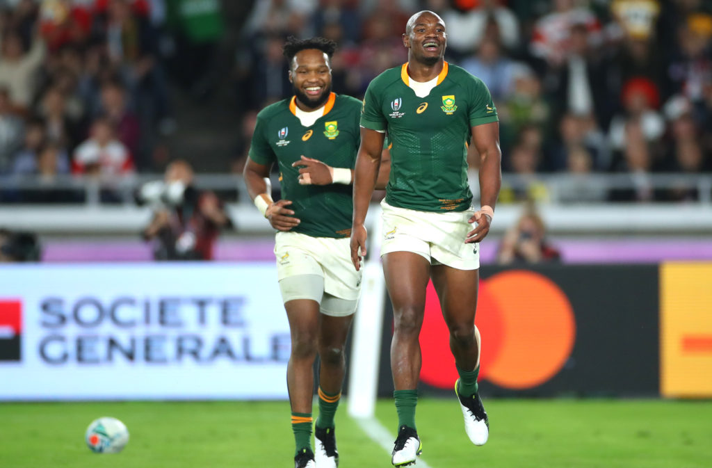 Makazole Mapimpi of South Africa celebrates with team mate Lukhanyo Am after scoring their team's first try during the Rugby World Cup 2019 Final