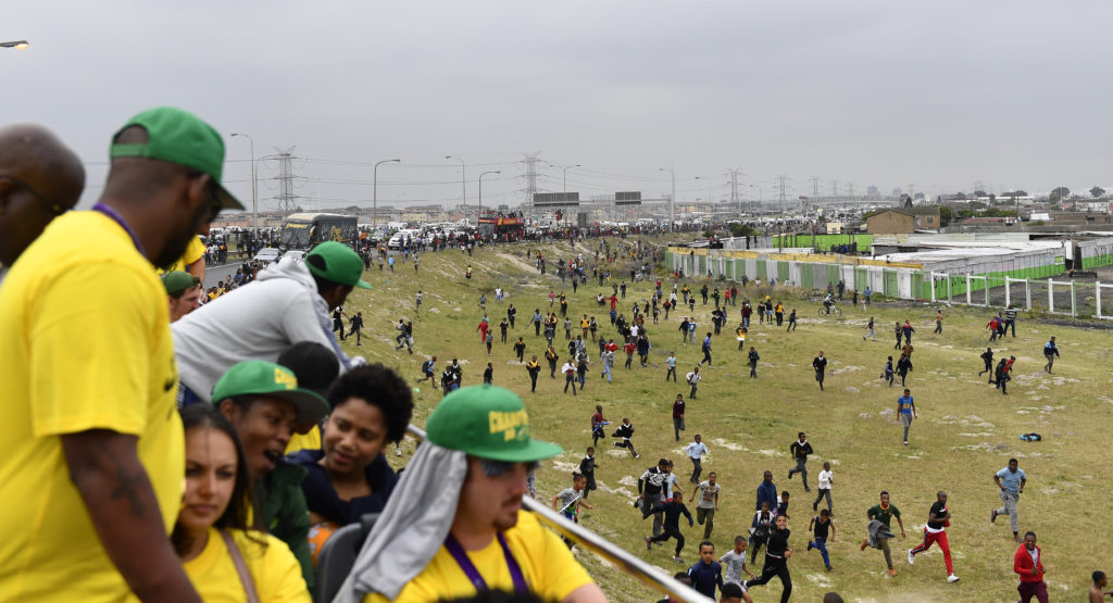 Residents of Langa pursue the Springbok bus