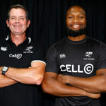 Sean Everitt and Lukhanyo Am in Sharks kit, arms folded