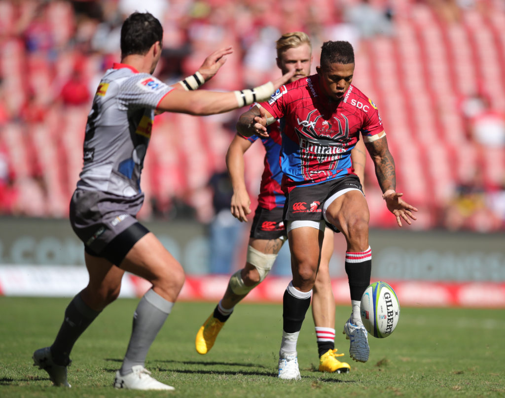 Lions pivot Elton Jantjies kicks for his players to chase