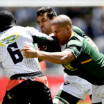 Jeff Oluoch of Kenya tackled by Chris Dry and Zain Davids of South Africa during day 3 of the 2019 HSBC Cape Town Sevens