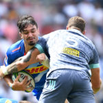 Jaco Coetzee tackled against the Hurricanes