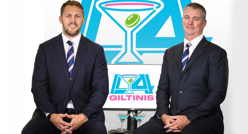 Stephen Hoiles and Darren Coleman pose in front of the LA Giltinis' logo