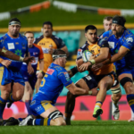 Brumbies wing Tom Wright carries the ball