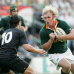 Schalk Burger charges at Dan Carter