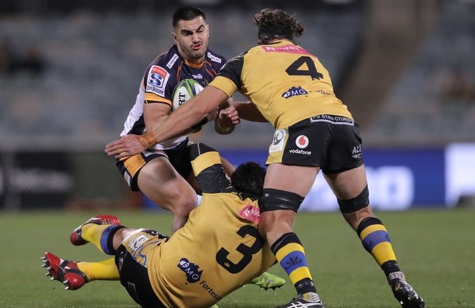 The Brumbies' Tom Wright takes on the Force defence
