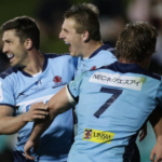 The Waratahs celebrate a try