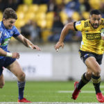 Ngani Laumape of the Hurricanes evades Beauden Barrett of the Blues during the round 6 Super Rugby Aotearoa match between the Hurricanes and the Blues at Sky Stadium on July 18, 2020 in Wellington, New Zealand. (Photo by Hagen Hopkins/Getty Images)