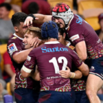 The Reds celebrate Tate McDermott's try