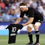 Sam Cane presents a Maradona New Zealand jersey to Argentina