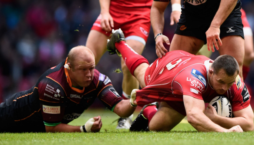 Brok Harris makes a desperate tackle on the ground