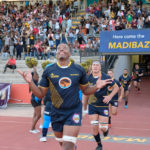 NMU Madibaz running onto the field