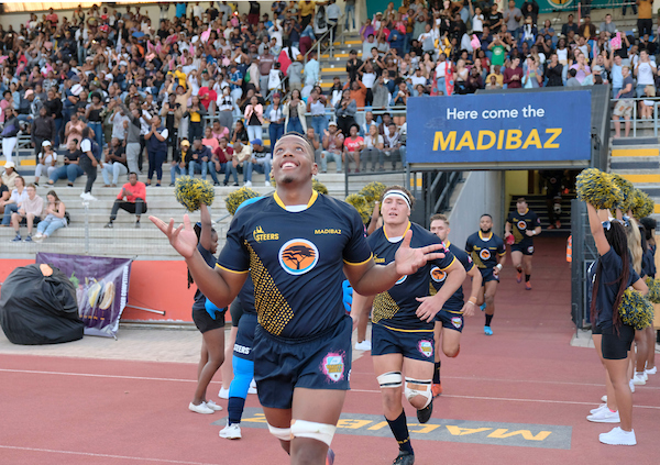 NMU Madibaz running onto the field