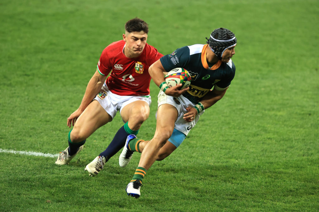 CAPE TOWN, SOUTH AFRICA - JULY 14: British & Irish Lions player Louis Rees-Zammit is beaten by South Africa A wing Cheslin Kolbe during the match between South Africa A and the British and Irish Lions at Cape Town Stadium on July 14, 2021 in Cape Town, South Africa.